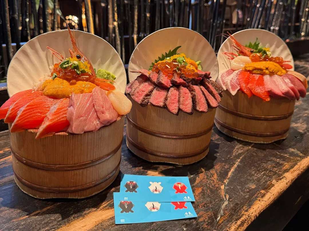 Three assorted kaisendon bowls with seafood and beef.