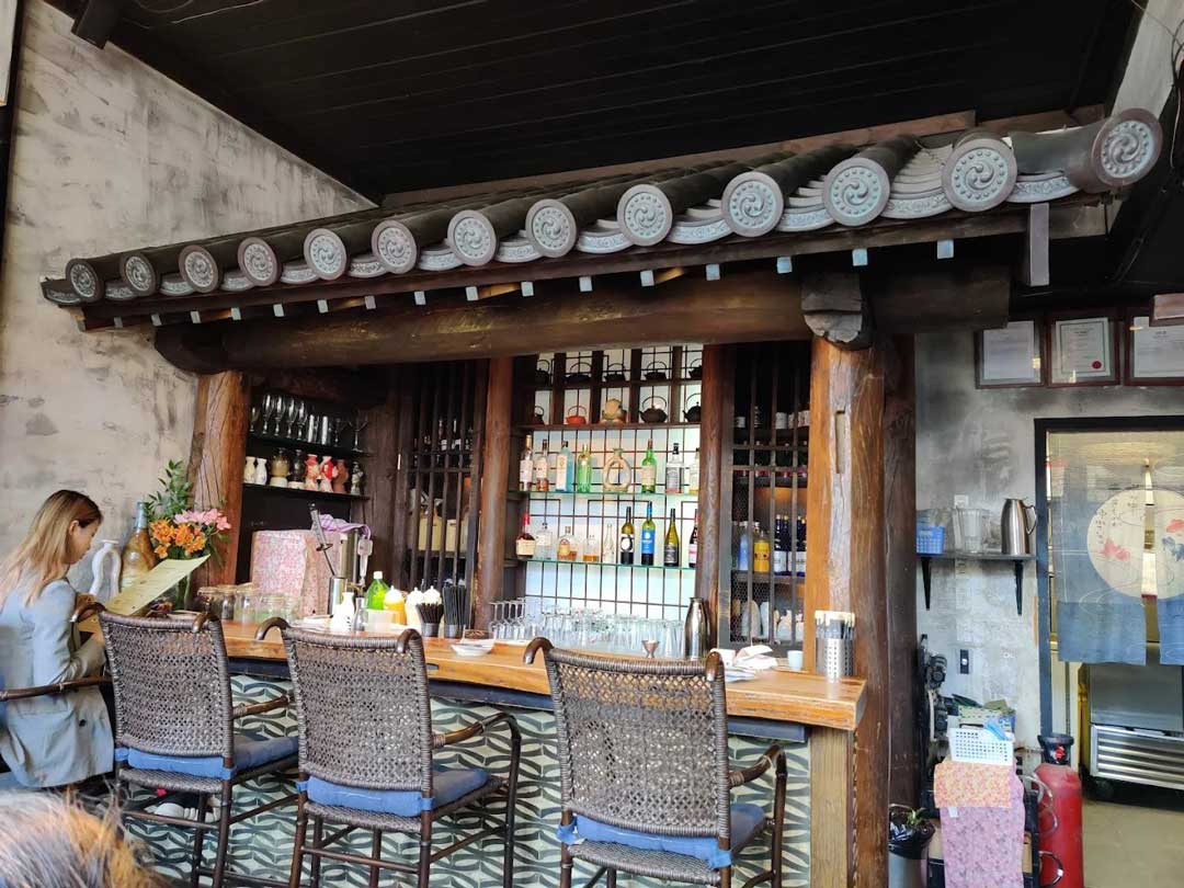 Bar counter with traditional Japanese roof decor at Kingyo.