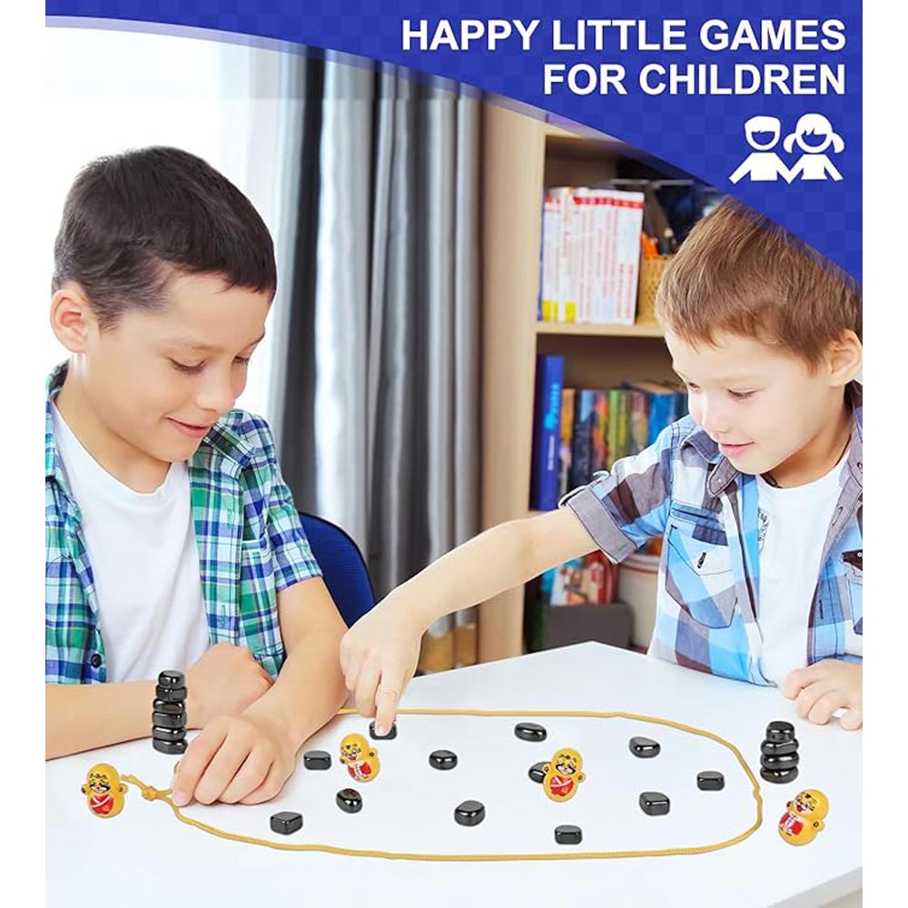Two children playing a magnetic tabletop game together.