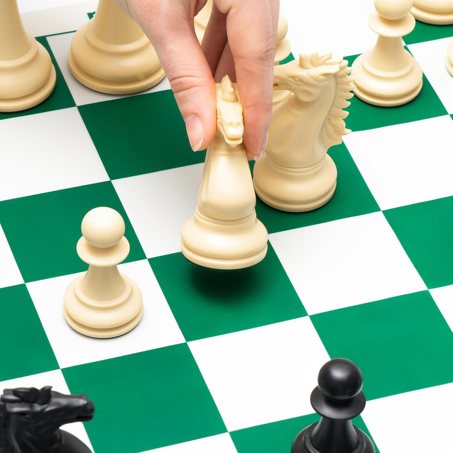 Close-Up of Hand Moving Weighted Chess Piece.